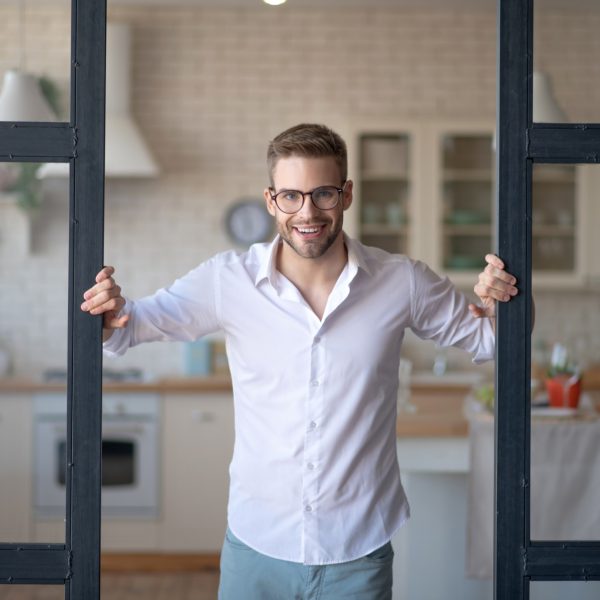 a-young-man-in-eyeglasses-staning-and-looking-dete-2024-10-11-18-01-05-utc (1)